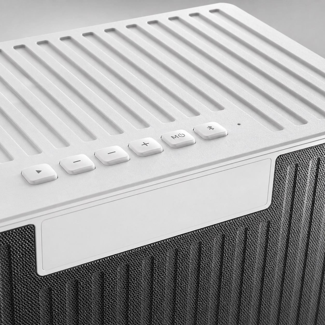 BH-101 white Bluetooth speaker top buttons and surface texture detail